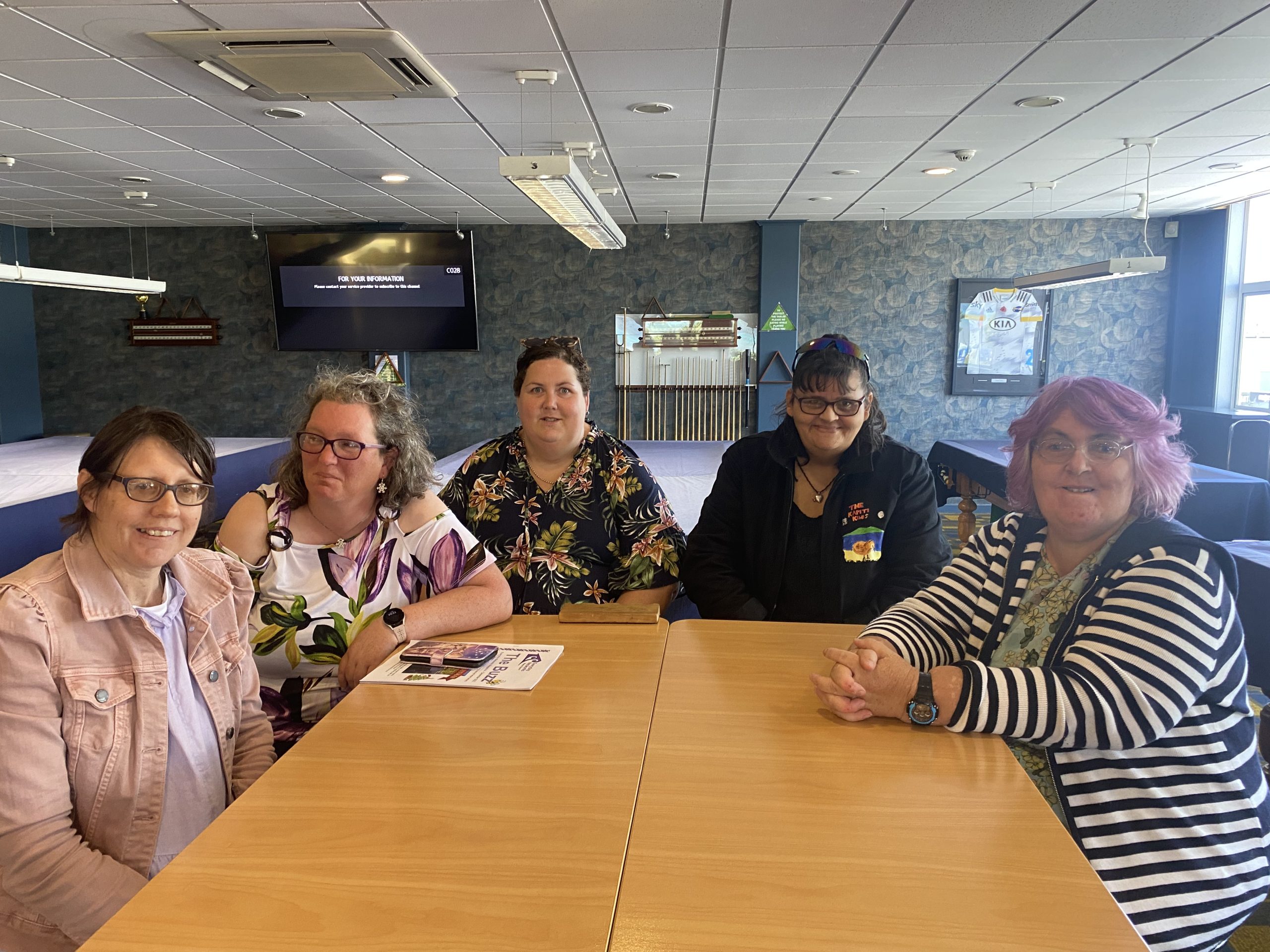 Kapiti kiwis network group sitting at a table